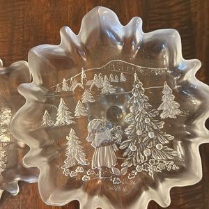 One small serving platters with slight white frost around scalloped edges.